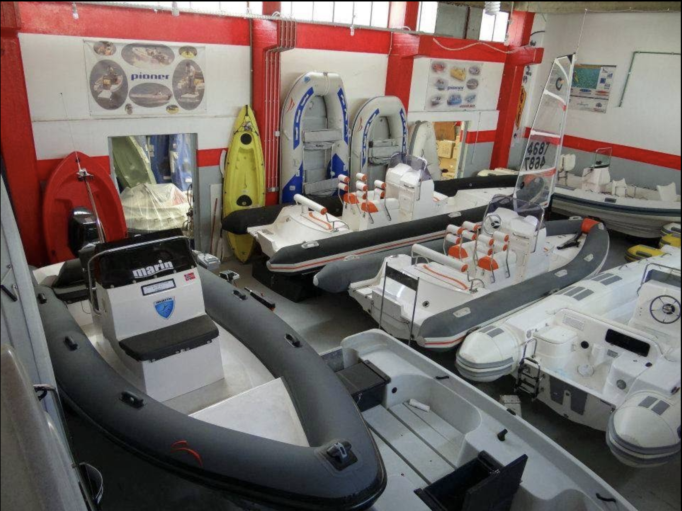 Showroom interior with boats and equipment